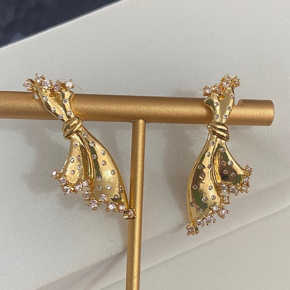 gold earrings with rhinestones
