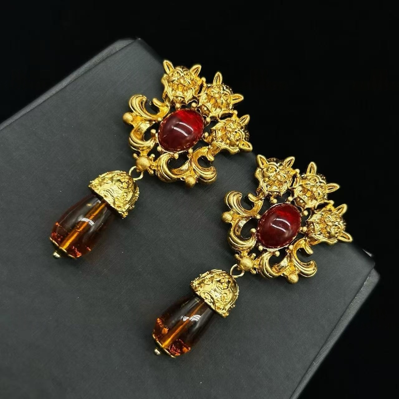 red gem statement earrings